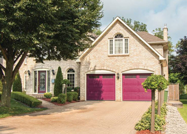colorful curb appeal obtained with red garage doors