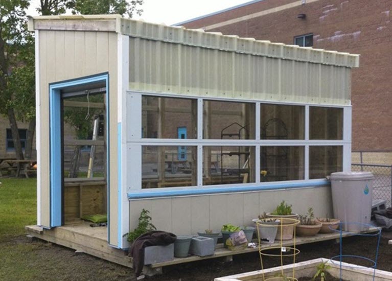 cover-recycled-garage-doors-for-greenhouse