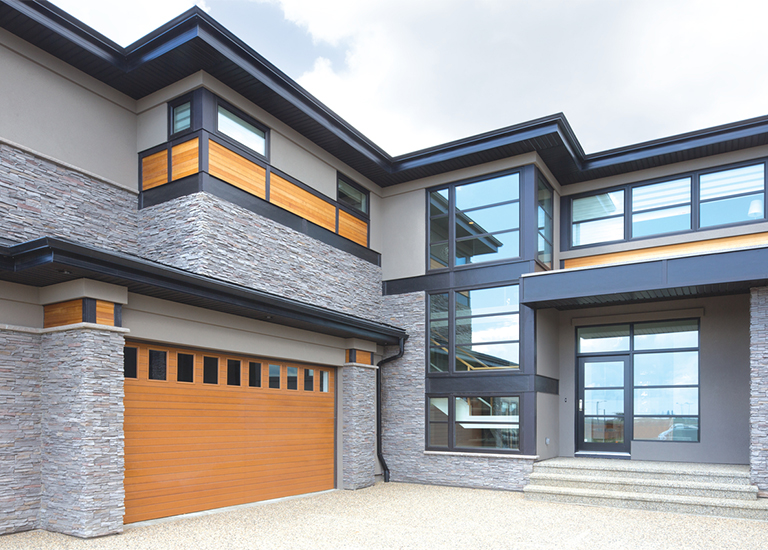 natural oak garage door on modern home