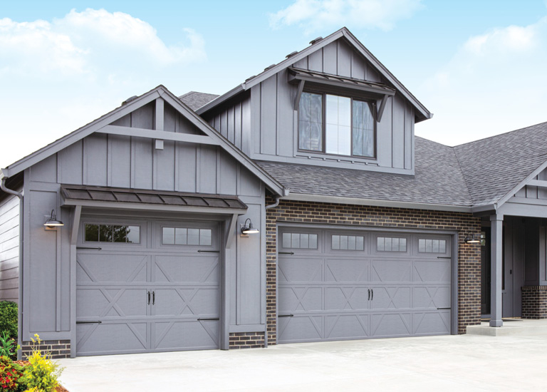 gray garage door with matching home