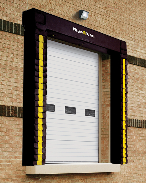 black fixed dock seal in front of a white sectional commercial door