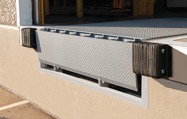 mechanical pit leveler for dock equipment on commercial building