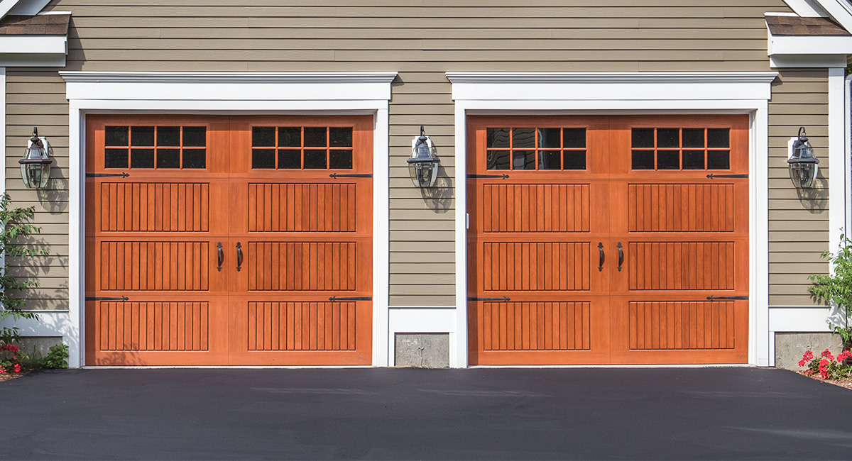 two cherry fiberglass garage doors with sixteen square windows