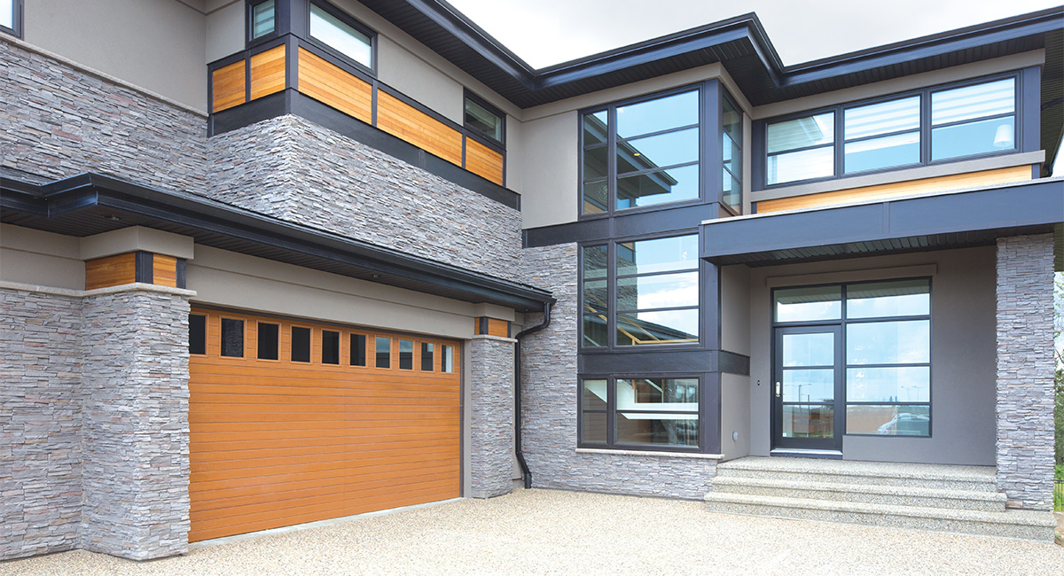 natural oak fiberglass garage doors with ten vertical windows