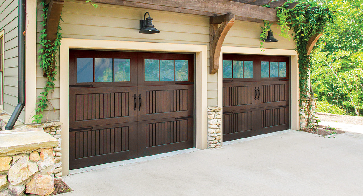 walnut fiberglass garage doors with twelve square windows and black hardware