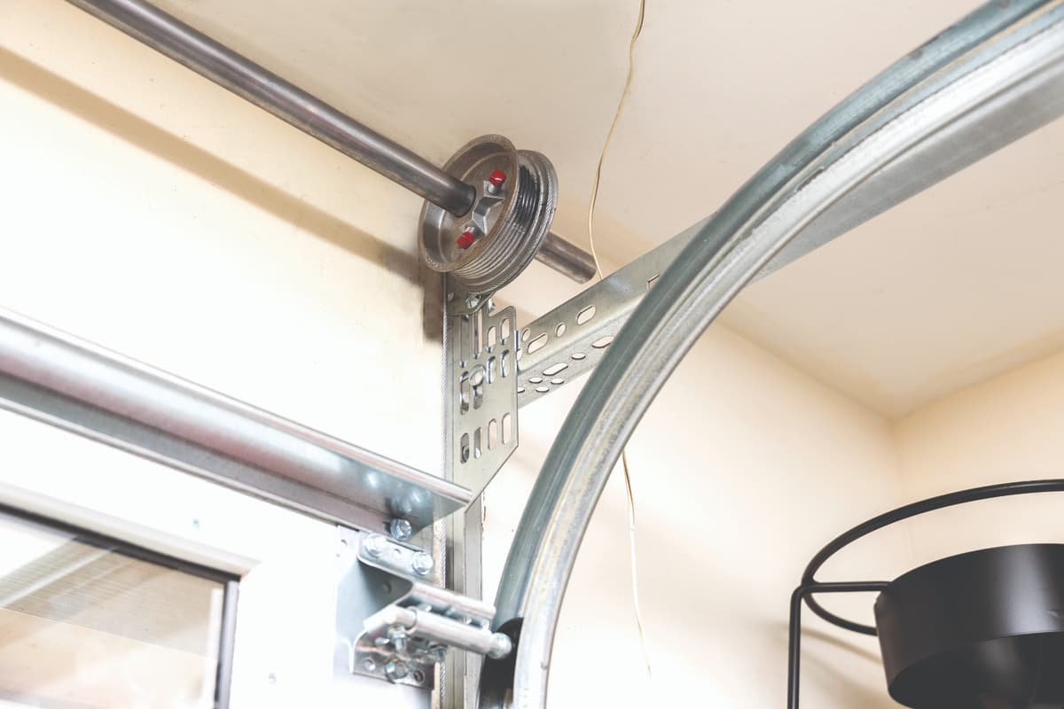close up of garage door cable drum