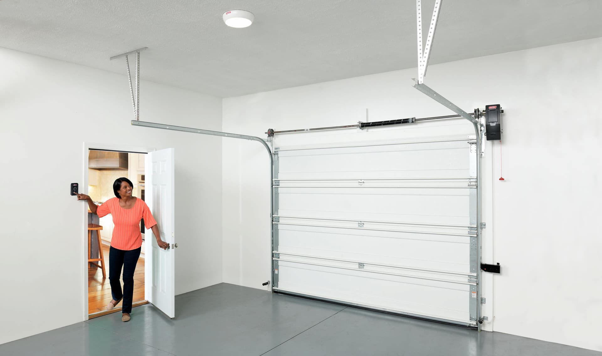 homeowner using Genie garage door opener