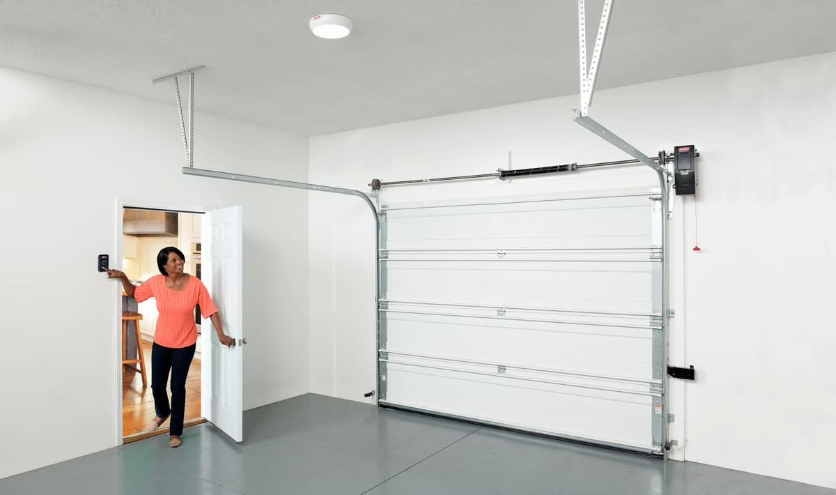 homeowner using Genie® garage door opener