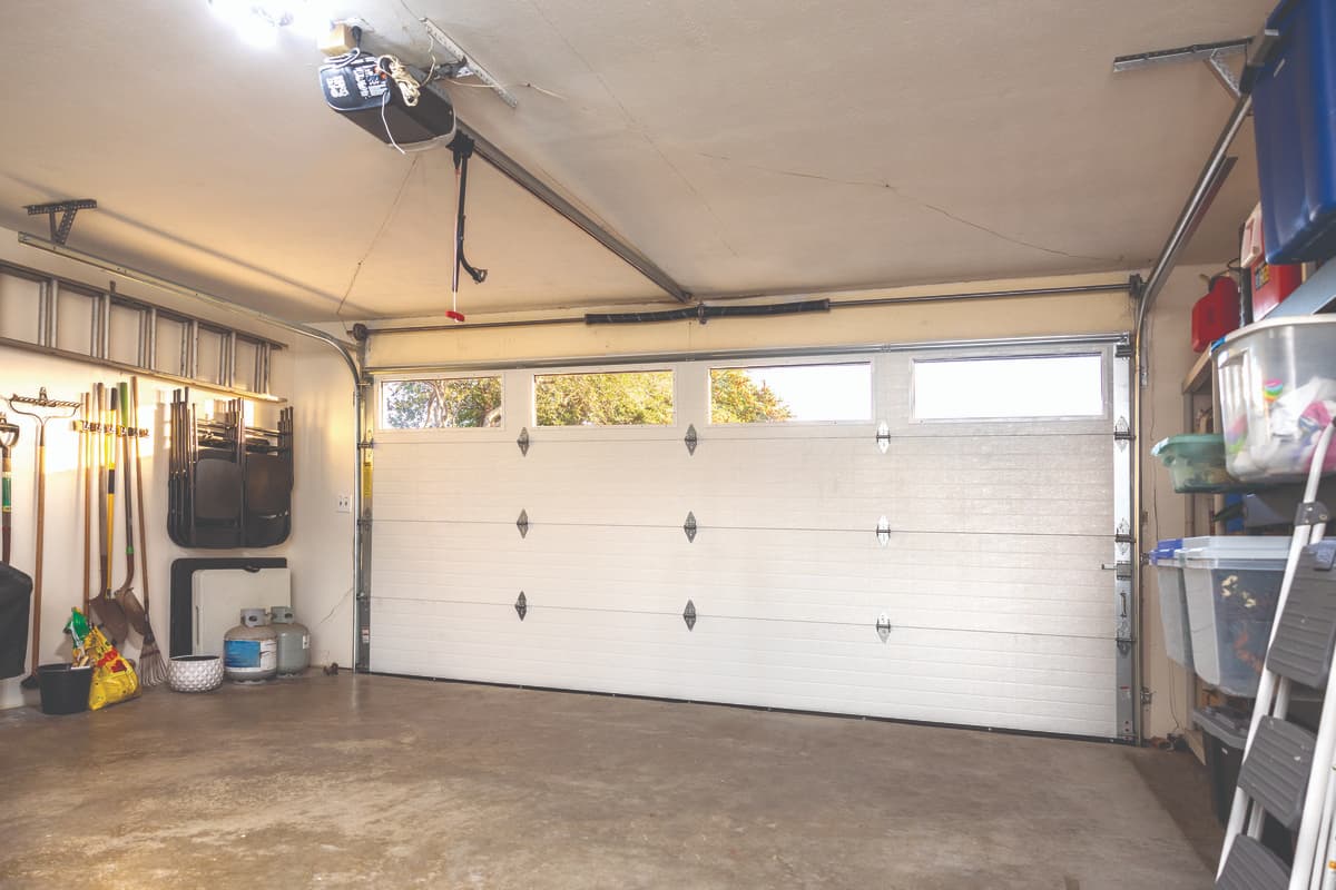 interior of garage with Wayne Dalton Model 8300 steel garage door and Genie® garage door opener