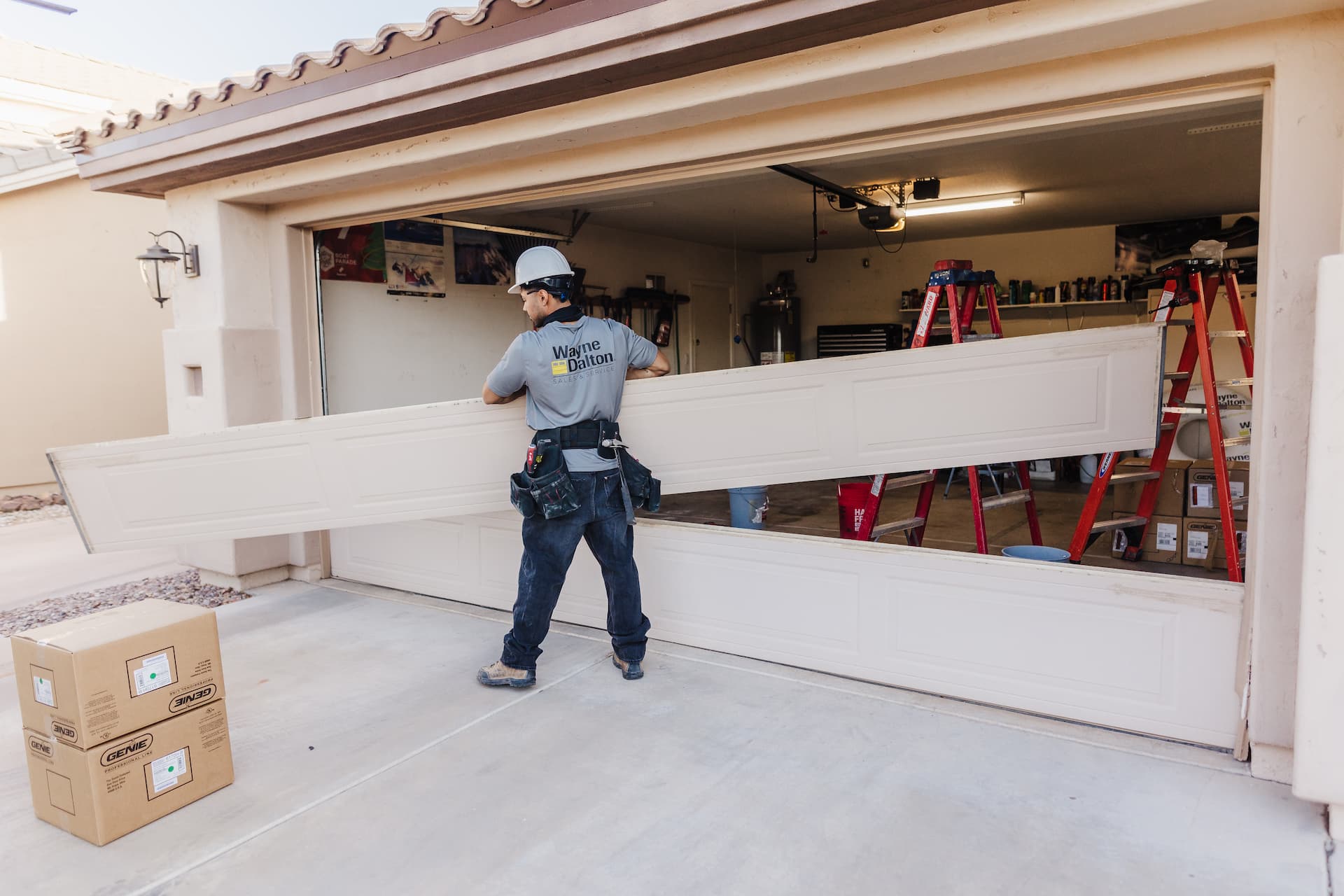 Wayne Dalton Sales & Service technician replacing a garage door