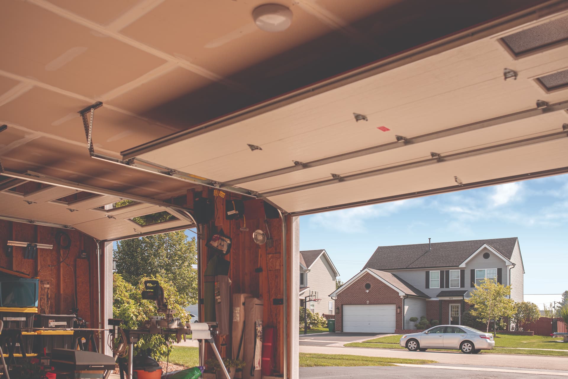 Interior view of garage with garage doors open