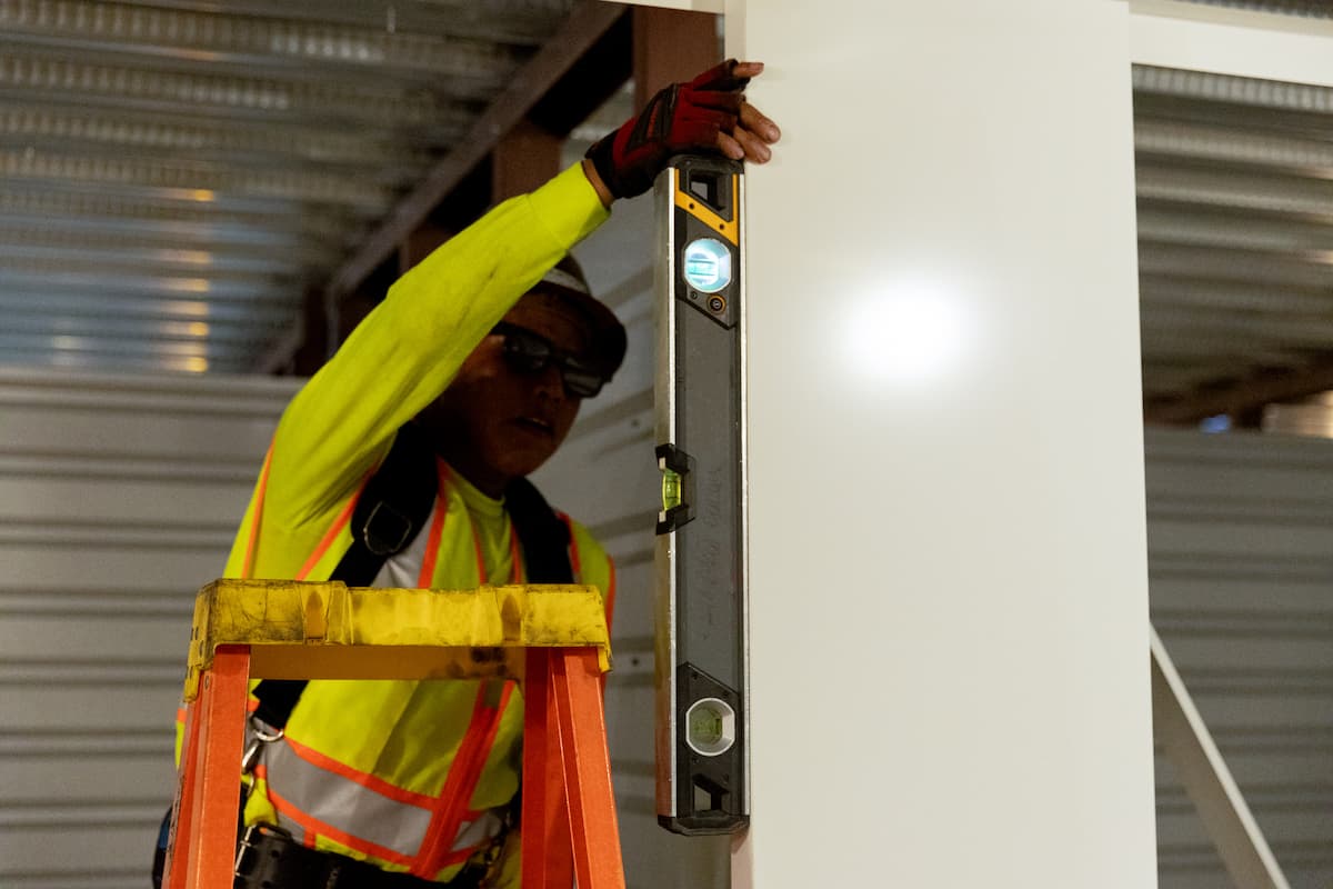 Wayne Dalton Sales & Service technician inspects commercial door opening Wayne Dalton Sales & Service technician inspects commercial door opening
